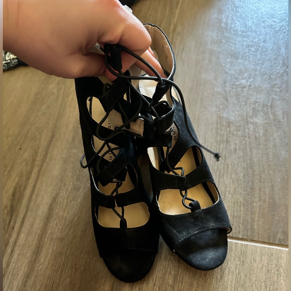 Black heels, ties at top. Size 8. Great condition.